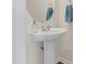 Clean and simple pedestal sink and modern faucet creates an elegant bathroom space at 4 Scottish Ln, Durham, NC 27707