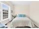 Inviting bedroom showcasing a window with blinds and a bed with decorative pillows at 4 Scottish Ln, Durham, NC 27707
