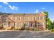 Attractive brick townhomes with well-maintained landscaping, creating a welcoming curb appeal at 4 Scottish Ln, Durham, NC 27707