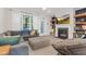 Inviting living room featuring a fireplace, built-in shelves, and comfortable seating at 4 Scottish Ln, Durham, NC 27707
