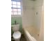 Bright bathroom with a window and a tub/shower combo at 411 Gooseneck Drive # B6, Cary, NC 27513