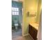 Well-lit bathroom features a single sink vanity and a tub/shower combo at 411 Gooseneck Drive # B6, Cary, NC 27513