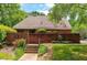 Inviting brick clubhouse with landscaped entrance, offering a welcoming community gathering space at 411 Gooseneck Drive # B6, Cary, NC 27513