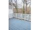 Exterior deck with a white wood railing overlooking trees at 411 Gooseneck Drive # B6, Cary, NC 27513