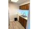 Traditional kitchen with wood cabinets, white appliances, and double basin sink at 411 Gooseneck Drive # B6, Cary, NC 27513