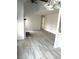 Living room featuring gray wood flooring, vaulted ceilings, and modern lighting at 411 Gooseneck Drive # B6, Cary, NC 27513