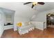 Bonus room with hardwood floors, vaulted ceiling, and window seat at 4217 Pike Rd, Raleigh, NC 27613