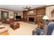 Cozy living room with brick fireplace, built-in bookshelves, and comfortable seating offers a relaxing atmosphere at 4217 Pike Rd, Raleigh, NC 27613