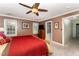 Comfortable bedroom featuring wood furniture, neutral carpet and ceiling fan at 4217 Pike Rd, Raleigh, NC 27613