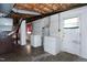 A laundry area with washer and dryer in unfinished basement at 4308 James Rd, Raleigh, NC 27616