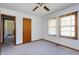 A cozy bedroom with a ceiling fan, a closet, and bright natural light at 4308 James Rd, Raleigh, NC 27616