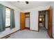 A clean bedroom with a closet, carpet, and natural light at 4308 James Rd, Raleigh, NC 27616