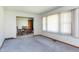Inviting living room featuring neutral carpet and an adjacent dining area at 4308 James Rd, Raleigh, NC 27616
