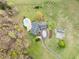 Aerial view of a landscaped home with a pool and a barn on an expansive lot at 500 Walnut Hill Dr, Hillsborough, NC 27278