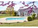 Beautiful backyard featuring a pool, a patio, and purple blossoms at 500 Walnut Hill Dr, Hillsborough, NC 27278