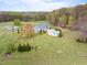Aerial view of a home and a pool, with well-maintained yard and landscaping at 500 Walnut Hill Dr, Hillsborough, NC 27278