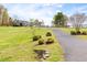Long driveway leading to a beautiful home, surrounded by well-maintained landscaping at 500 Walnut Hill Dr, Hillsborough, NC 27278