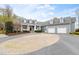 Elegant home with circular brick driveway and three-car garage at 500 Walnut Hill Dr, Hillsborough, NC 27278