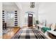 Bright foyer with hardwood floors and stylish decor at 500 Walnut Hill Dr, Hillsborough, NC 27278
