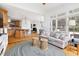 Inviting living room with hardwood floors open to kitchen at 500 Walnut Hill Dr, Hillsborough, NC 27278
