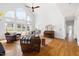 Bright living room with hardwood floors, many windows, and vaulted ceiling at 500 Walnut Hill Dr, Hillsborough, NC 27278