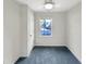 Bedroom features neutral walls, carpet, ceiling fan and light, and window at 5005 Baywood Forest Dr, Knightdale, NC 27545