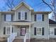 Charming two-story home with a well-maintained lawn and inviting front porch at 5005 Baywood Forest Dr, Knightdale, NC 27545