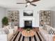 Bright living room featuring stylish decor, a fireplace, and a ceiling fan for added comfort at 5005 Baywood Forest Dr, Knightdale, NC 27545