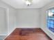 Living room features hardwood floors, neutral walls, and natural light from window at 5005 Baywood Forest Dr, Knightdale, NC 27545