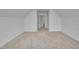 Bedroom with neutral carpet, bright white walls, with several adjoining hallways and rooms at 5033 Homeplace Dr, Apex, NC 27539