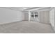 Spacious bedroom features neutral carpet, double closets, and a bright window at 5033 Homeplace Dr, Apex, NC 27539