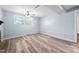Finished basement with a large window, laminate flooring, and drop ceiling at 506 N Harrison Ave, Cary, NC 27513