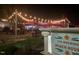 Nighttime exterior view of the Tiki Brewing Beach House with outdoor seating at 506 N Harrison Ave, Cary, NC 27513