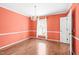 Bright dining room with hardwood flooring and large windows that provide great natural light at 516 Edinburgh Dr, Burlington, NC 27215