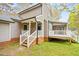 Home exterior showcasing gray siding, white trim, and inviting porch at 516 Edinburgh Dr, Burlington, NC 27215