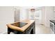 Kitchen island in a bright kitchen with decorative lighting at 516 Edinburgh Dr, Burlington, NC 27215