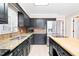 Kitchen featuring stainless steel appliances and granite countertops and a view into another room at 516 Edinburgh Dr, Burlington, NC 27215