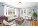 Bright living room with a large bay window and french doors at 516 Edinburgh Dr, Burlington, NC 27215