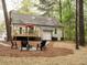 Backyard with deck, patio, fire pit and seating, great for entertaining and relaxing outdoors at 5209 Rivington Rd, Fuquay Varina, NC 27526
