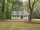 Charming home with inviting front porch, dormer windows, and surrounded by mature trees at 5209 Rivington Rd, Fuquay Varina, NC 27526