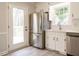 Modern kitchen with stainless steel appliances and backyard access at 5209 Rivington Rd, Fuquay Varina, NC 27526
