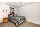 Cozy bedroom features earth tone colors and carpeted floors at 5551 Vista View Ct, Raleigh, NC 27612
