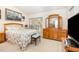 Bright bedroom with floral bedding, wood furniture, and lots of natural light at 5551 Vista View Ct, Raleigh, NC 27612