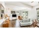 Open-concept living room with hardwood floors, neutral walls, and ample natural light from large windows at 5551 Vista View Ct, Raleigh, NC 27612