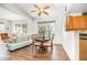 Bright and airy living room featuring hardwood floors, a cozy dining area, and modern decor at 5551 Vista View Ct, Raleigh, NC 27612