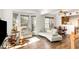 Spacious living room filled with natural light, hardwood floors, and comfortable seating arrangements at 5551 Vista View Ct, Raleigh, NC 27612