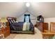 Bedroom with neutral carpet, a large bed and wood furnishings under a vaulted ceiling at 5578 Tabbs Creek Church Rd, Oxford, NC 27565
