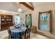 Traditional dining room with wood trim, a decorative chandelier and large windows with backyard views at 5578 Tabbs Creek Church Rd, Oxford, NC 27565