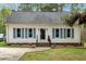 Charming single story home featuring blue shutters and landscaped front yard at 5578 Tabbs Creek Church Rd, Oxford, NC 27565