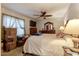 A carpeted main bedroom offers comfort, good natural light, and a ceiling fan at 5578 Tabbs Creek Church Rd, Oxford, NC 27565